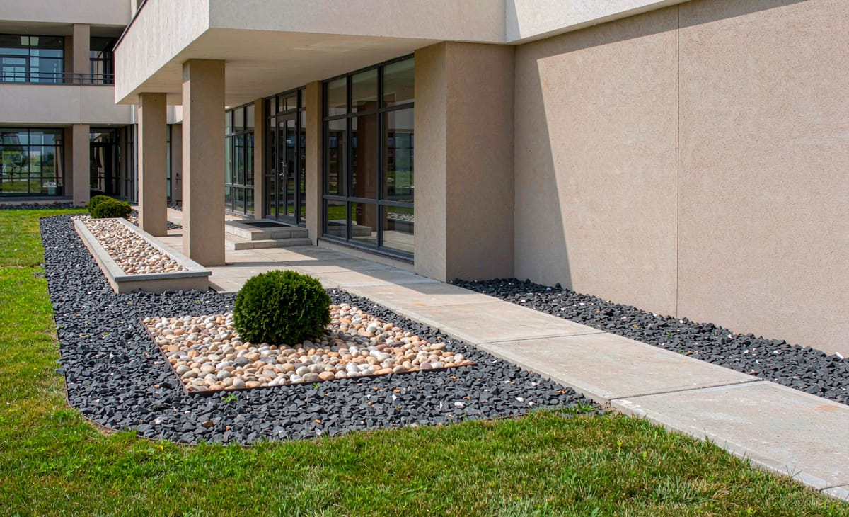 Commercial landscape beds with decorative gravel