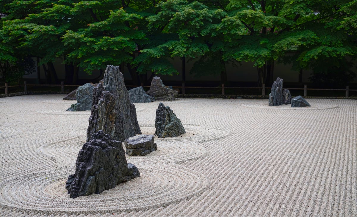 Raked sand and stones in a Zen garden
