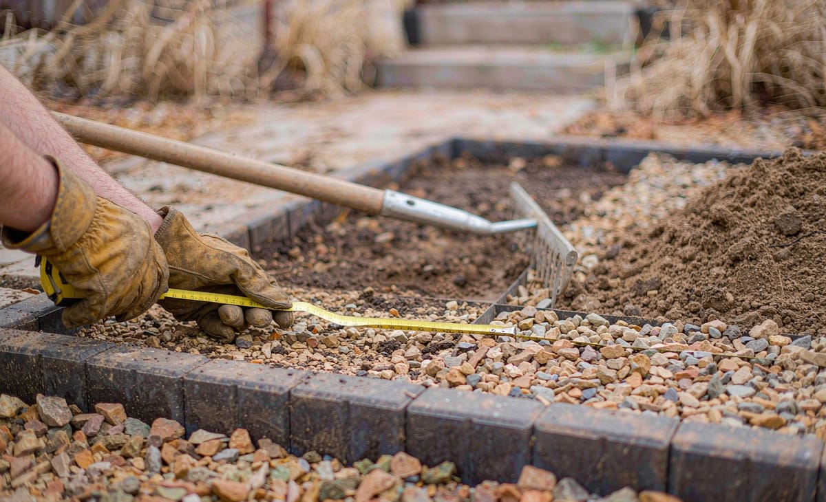 Measuring a garden area for landscaping stone coverage