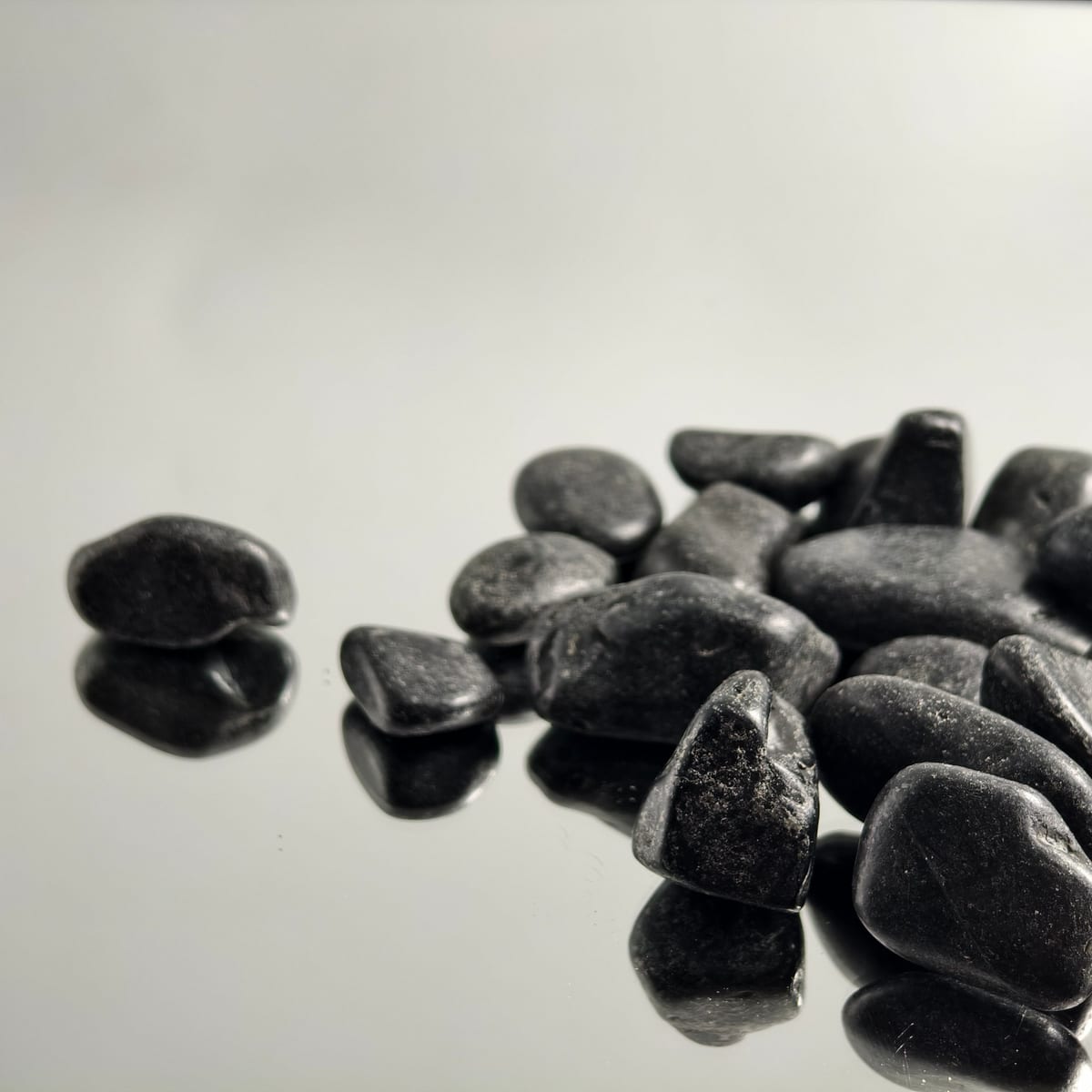Black landscaping pebbles with glossy finish