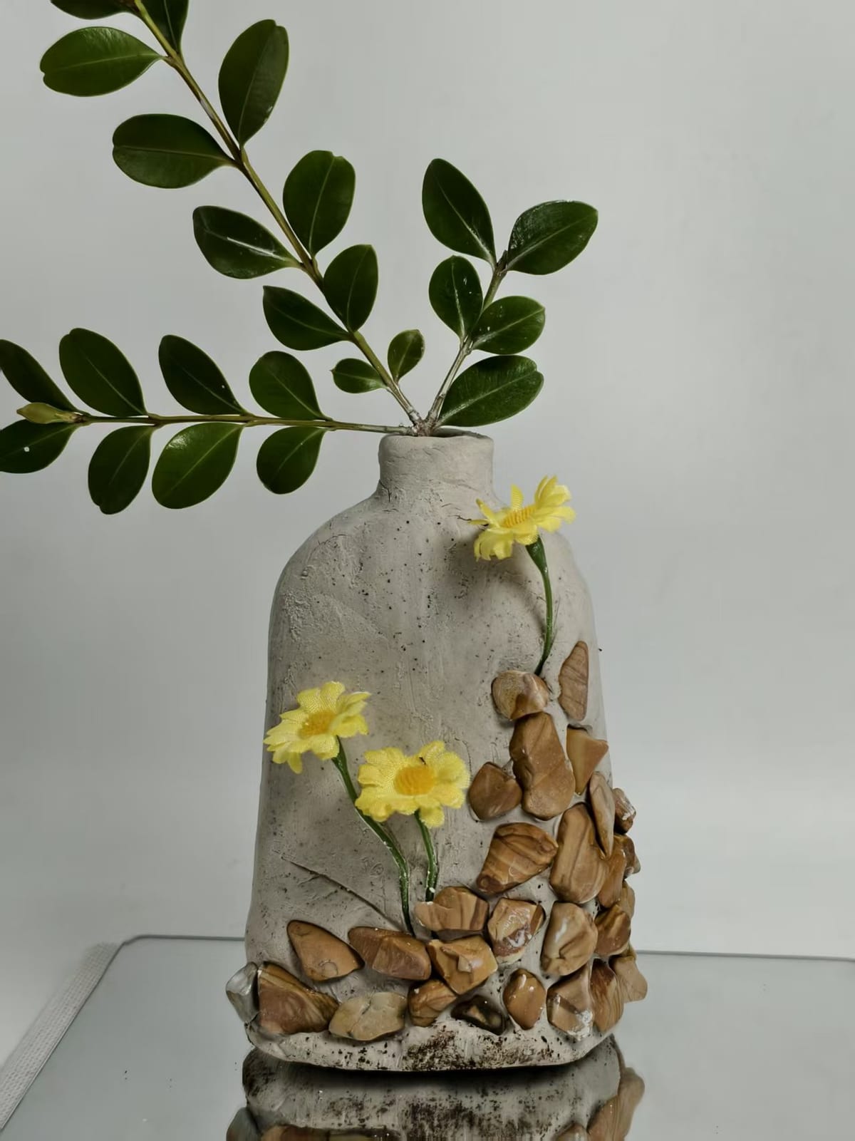 Decorative landscape stone used in a glass vase floral arrangement