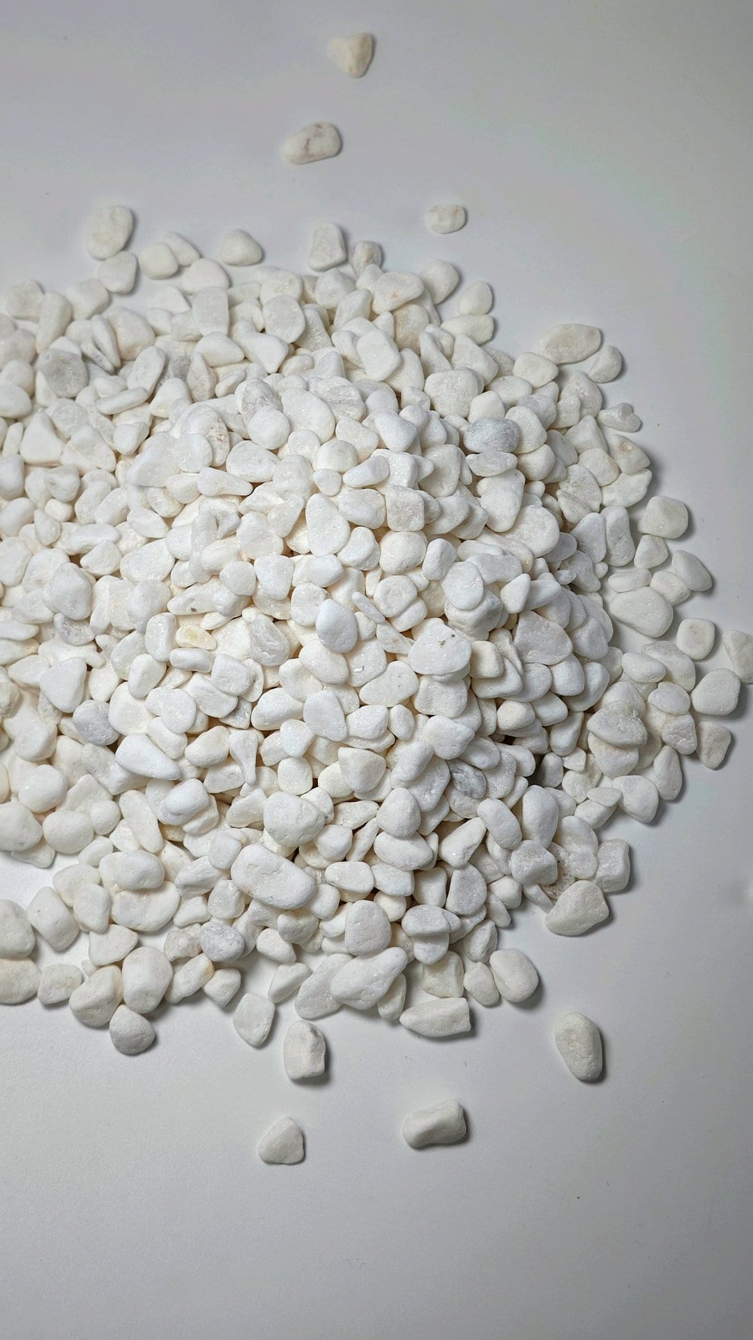 White gravel landscaping with polished white stones